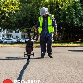 Pro-Pave Inc. Contractor Filling Crack in Asphalt