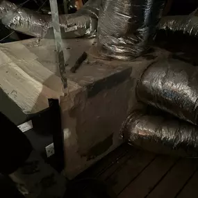 HVAC unit in attic; air ducts connected; before cleaning