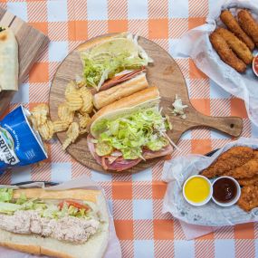 An assortment of our various offerings spread on a picnic tablecloth