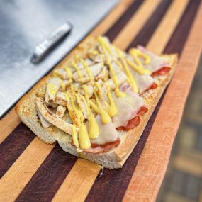 Our Cordon Bleu is served with grilled chicken, smoked ham, melted swiss & honey mustard