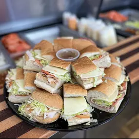 An assortment of party size sandwiches perfect for any event