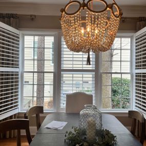 Enhance your dining room’s ambiance by incorporating shutters! Shutters are great for privacy and sun protection, and these installed locally allow for a fully unhindered view when opened. Schedule your FREE in-home consultation today to find the perfect custom shutters for your home!