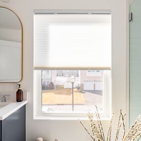 In this stylish bathroom, cellular shades cast a lovely glow. Easily adjust them for privacy and insulation, thanks to their convenient up-and-down operation. Plus, their cordless design ensures a safe environment for children and pets!