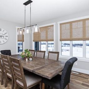 This gorgeous dining room is infused with an artisanal and earthy ambiance, thanks to our woven wood shades. They are made from 100% organic materials, making them environmentally friendly window treatments and completely recyclable.