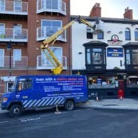 Bild von Man with a Cherry Picker Van