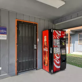 a vending machine sits outside of a building