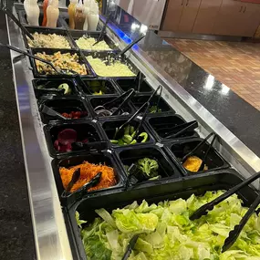 Salad Bar - Prepared salads, 12 toppings, dressings, homemade croutons