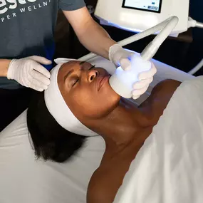 A woman receiving Neveskin facial.