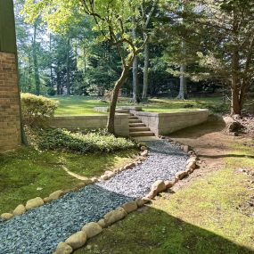 Pathway to beautiful retaining wall and staircase by RC Landscapes