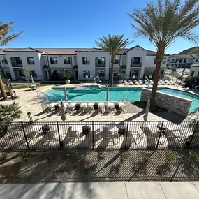 Swimming pool with apartment building in the background