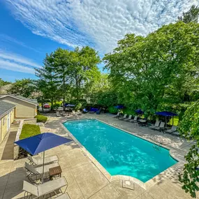 a backyard with a pool at Amberly Apartments, West Bloomfield, 48322