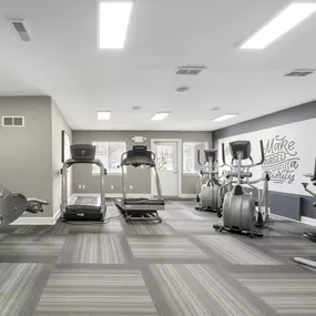 Gym with cardio machines and weights at Amberly Apartments, West Bloomfield, 48322