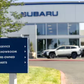 directional sign in front of Elk Grove Subaru Dealership serving Sacramento