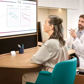 Miracle-Ear hearing aid center experience: woman checking her audiogram with hearing care specialist