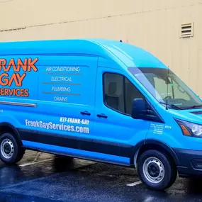 Frank Gay Services blue work van outside