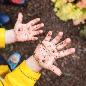 Nurturing Knowledge Preschool Maple Leaf Children Playing Rain or Shine