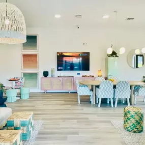 Clubhouse interior with ample seating and and a TV