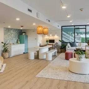 Interior of clubhouse with ample seating and lighti