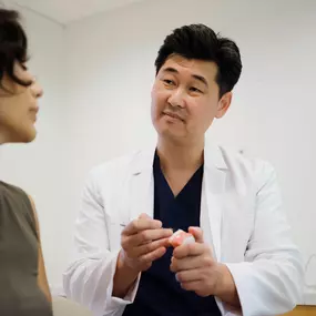 Dr. Yang with a patient.