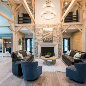 a living room with couches and chairs