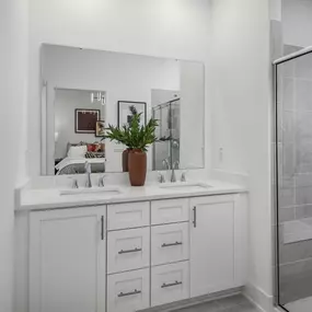 Primary bathrooms with dual vanities