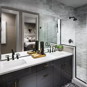 Primary bathroom with dual-sink vanity and walk-in shower