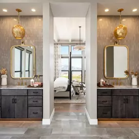 Primary baths with dual sink vanities and freestanding tub