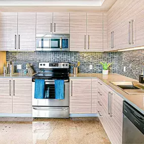 a kitchen with stainless steel appliances and white cabinets