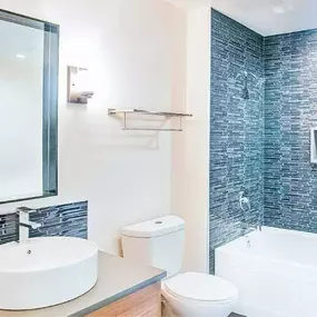 a bathroom with a sink toilet and a tub