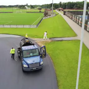 Asphalt Seal & Repair Contractors Sealcoating Pavement at a Sports Complex