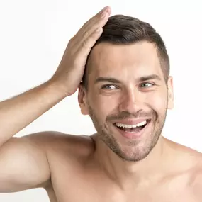 smiling-young-shirtless-man-touching-his-hair-white-backdrop-1024x683.jpg