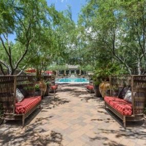 a backyard with a pool and furniture at Canyon Crossroads