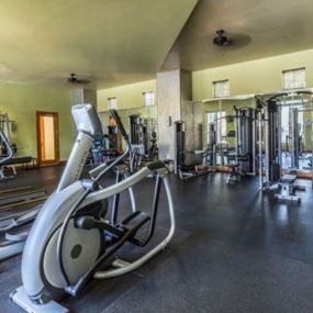 a gym filled with lots of workout equipment at Canyon Crossroads