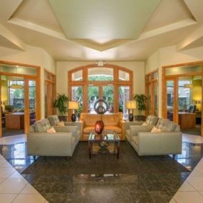 a view of a living room with couches and a table at Canyon Crossroads