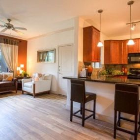 a kitchen and living room with a counter top at Canyon Crossroads