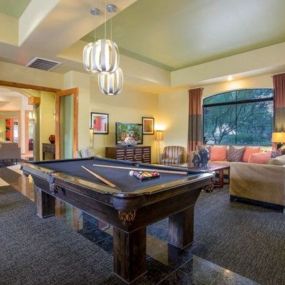 a large living room with a pool table at Canyon Crossroads