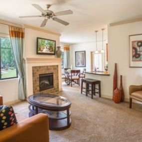 a living room with a couch and a fireplace at Canyon Crossroads