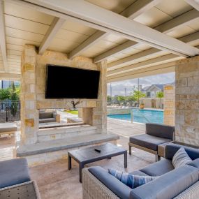 a living room with a fireplace and a television