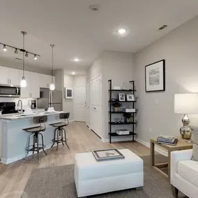 a living area with a kitchen and a couch