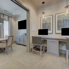 a dining room with a table and chairs and a tv