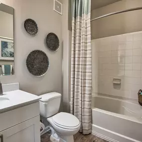 a bathroom with a sink toilet and a bath tub at Sterling Creek