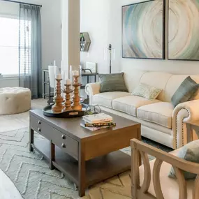 a living room with a couch and a table at Sterling Creek
