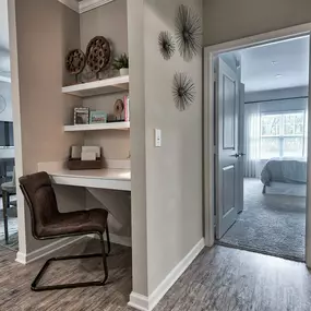 a home office with a desk and a door to a bedroom at Sterling Creek