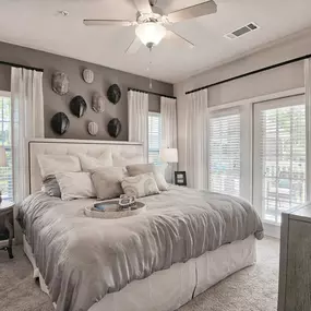 a bedroom with a bed and a ceiling fan at Sterling Creek
