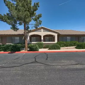 a house with a red curb in front of it at Desert Sage