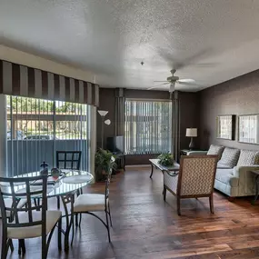 a living room and dining room with a table and chairs at Desert Sage