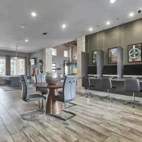 a barbershop with chairs and mirrors in a salon at Legacy Flats