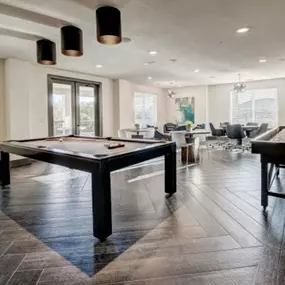 a game room with a pool table and a bar at The Jane at Preston Trail