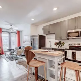 a kitchen and living room with a table and chairs at The Jane at Preston Trail