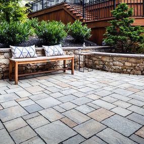 Paver patio and stone retaining walls.